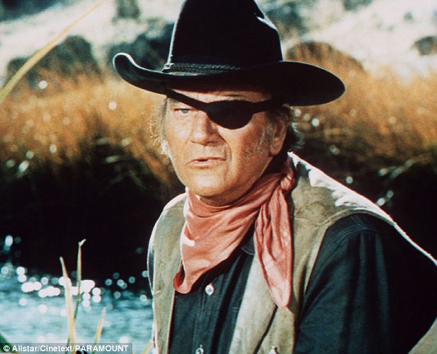 True grit: Wayne as Rooster Cogburn in the iconic 1969 Western. He had headed for Hollywood in the Twenties and found menial jobs in props and stunt-work, learning his techniques for horse-riding, roping, guns and fighting